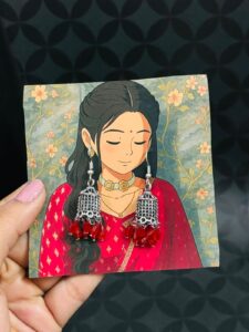Antique Oxidised Silver Jhumkas with Red Bead Tassels